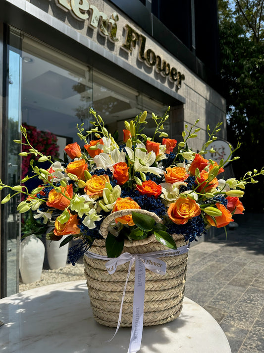 Orange Basket with Blue Baby Flowers